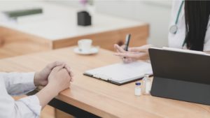 two people discussing business in an office