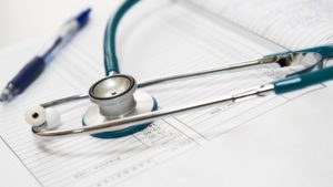 stethoscope on medical charts