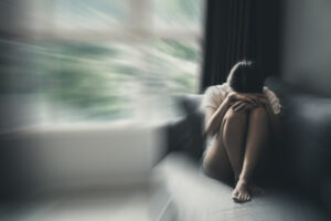 Woman curled up on a couch