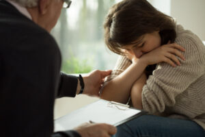 Woman crying in therapist office