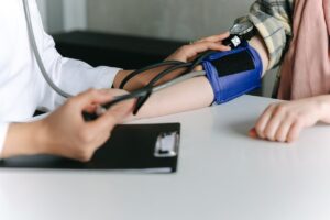 doctor taking blood pressure